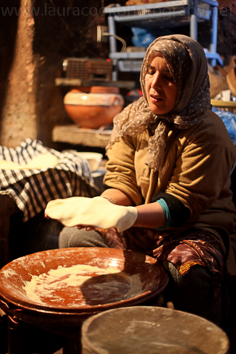 In the kitchen at the back of the house the flour and water is moulded into small circles and then pummeled ready for baking.