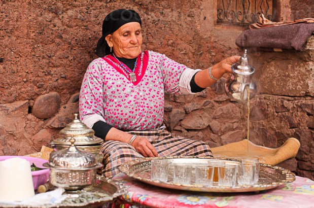Pouring the tea into the small glass beakers for the guests. Fatima has polished hostess skills!