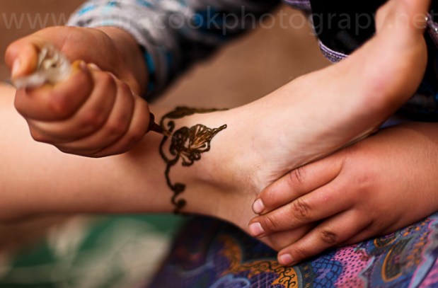 While the tea comes to the boil one of Fatima's family members creates a beautiful henna design.