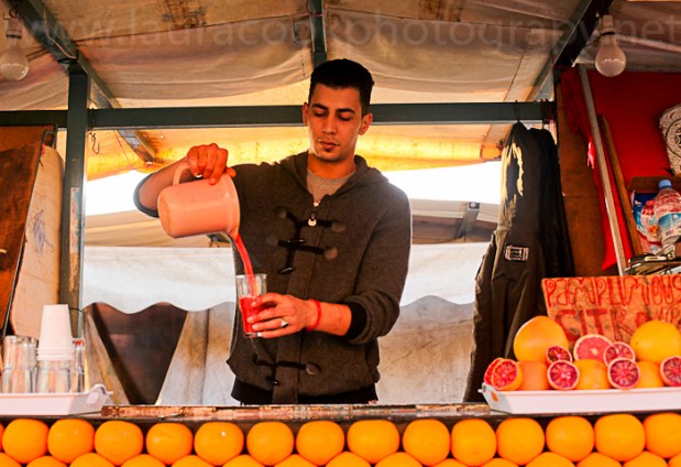 Jamaa el Fna is full of orange juice sellers at night.