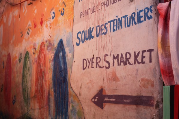 A bright and cheerful sign points the way in the heart of the traditional bazaar of Marrakech
