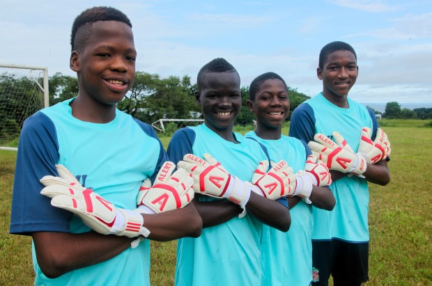 John Fillie, , Brima Kamara, Ahmed Tailu Mannah and Alusine Barrie  show off their Alert goalkeeping gloves