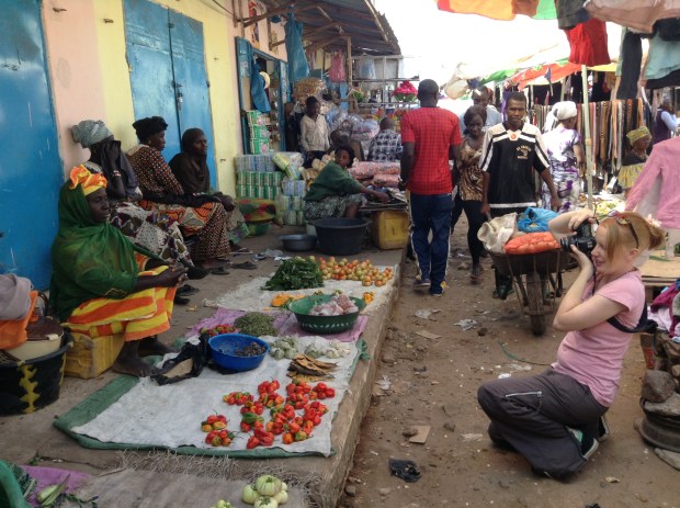 Trying to lean back as far as I can without falling over in Serrekunda market in the Market.