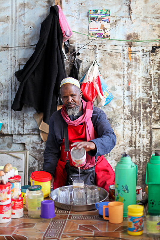 The breakfast seller makes porridge for early morning shoppers