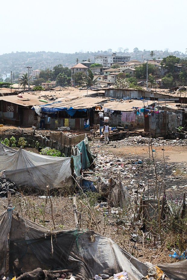 Homes and businesses operate alongside the rubbish dump