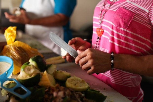 Casa Alianza has two centres where young people are brought to live and are supported through a number of programmes. Children are trained in important life and employment skills. Here a girl learns how to cook.