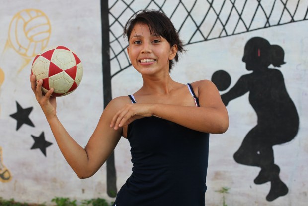 Sport is another key way of engaging and encouraging the young people. Here Alondra (a member of Team Nicaragua's female team) holds a football aloft.