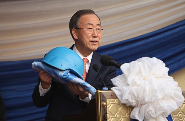 A symbolic moment as Ban Ki-Moon hands over a blue peace keeping helmet to the people of Sierra Leone to represent the end of the post-conflict peace process in Sierra Leone.  Image taken for UNIPSIL during the visit of the UN Secretary General to Sierra Leone. 5th March 2014 Copyright: Laura Cook Photography/UNIPSIL