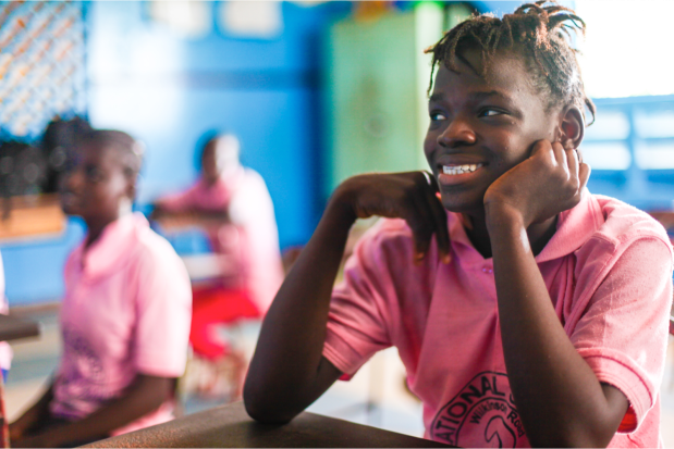 Girls together in their classroom.