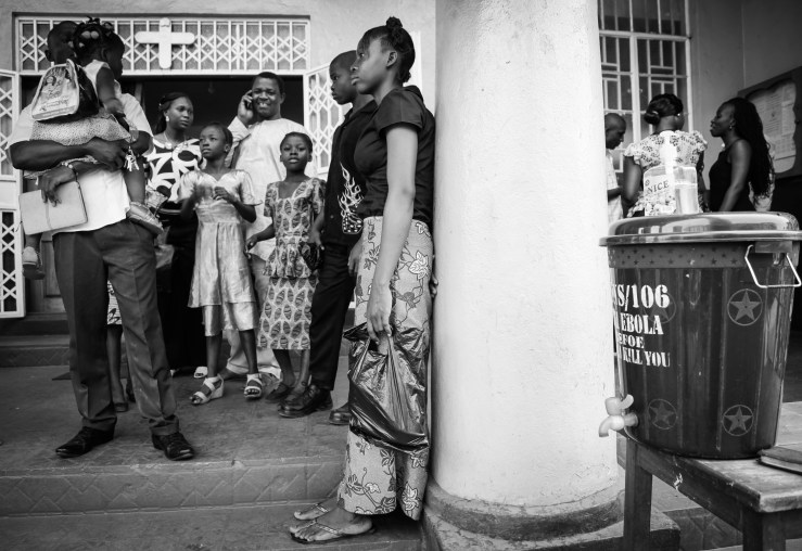 Regents Road Baptist Church in Freetown; worship continues but the now ubiquitous bucket of water has become par for the course as part of the Sunday routine.