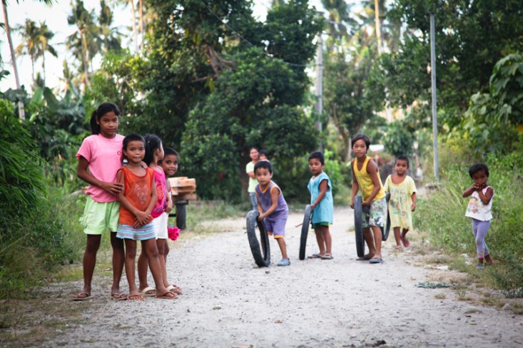 Children playing in Dulag, The Philippines. Racing hoops!