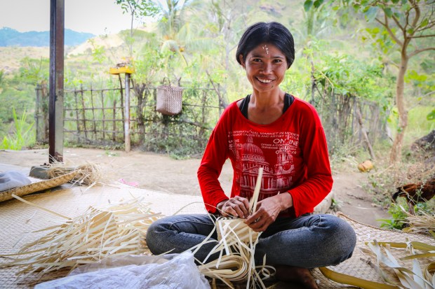 Women like Ketut Soka weave to make money to support their families. Previously in this area many women and children went to the tourist areas of Bali for begging: "Now we can make an income and there is work here to do. It is good because we are busy now".