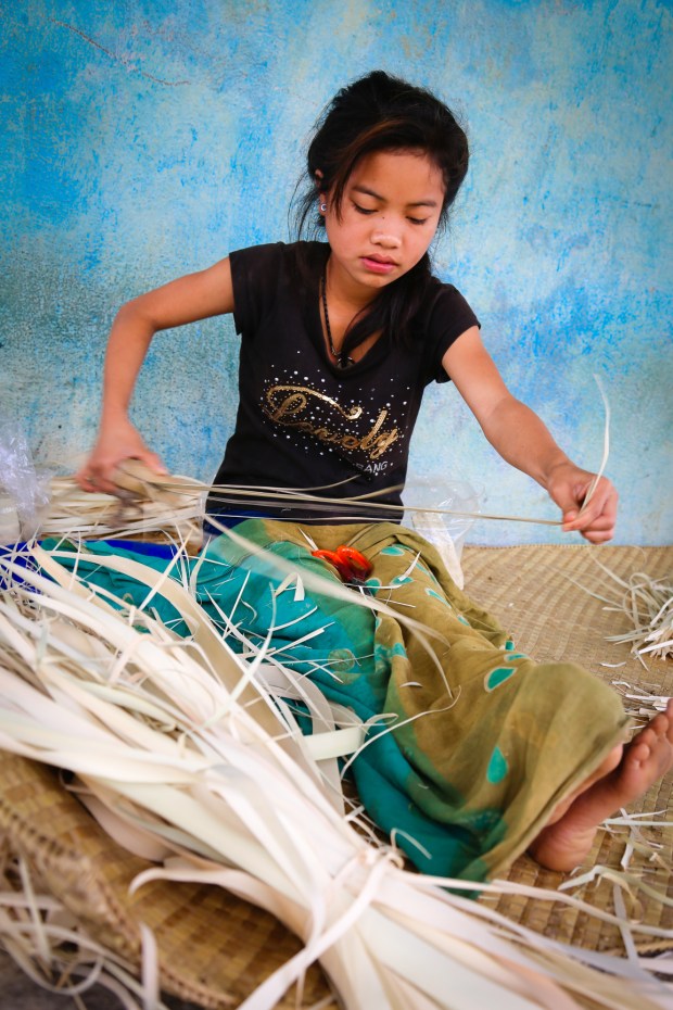 We met around twenty women and teenage girls weaving. They make small boxes that are sold as Christmas gifts and to hotels in Bali.