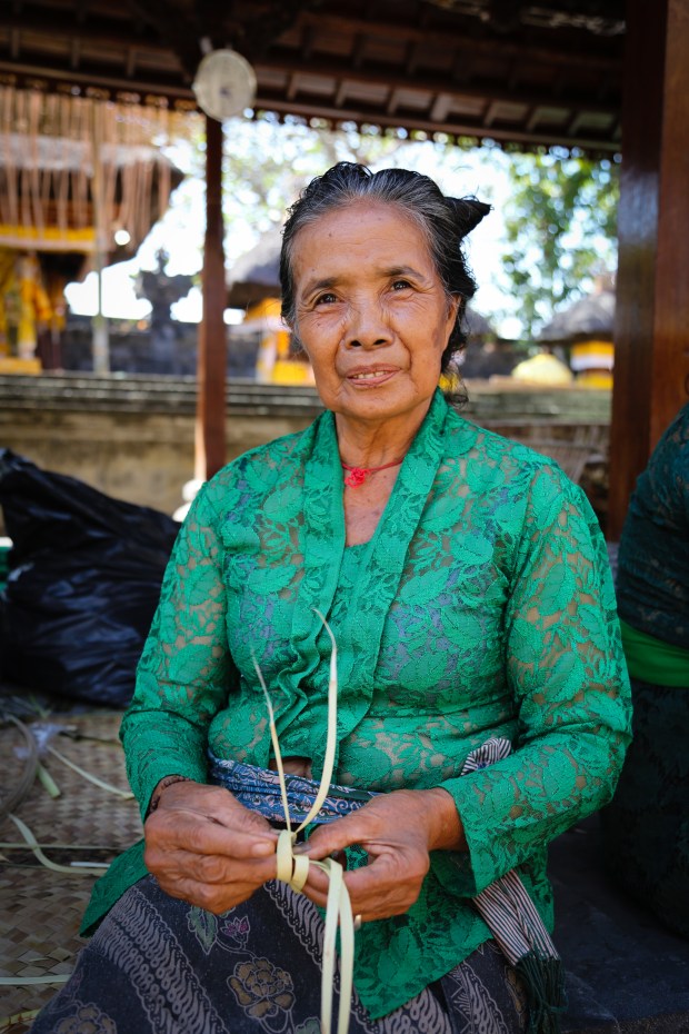 Women create the hundreds of offerings to prepared ahead of the Air Jeruk Temple ceremony.