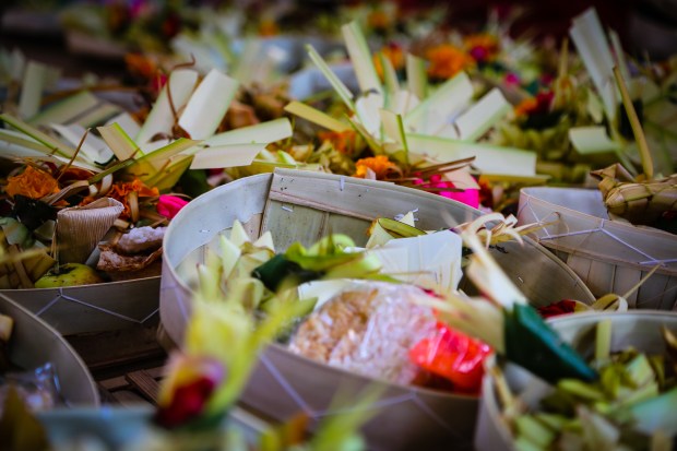 During the days before the ceremony offerings of fruit, rice and flowers are prepared by the women.
